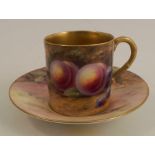 A Royal Worcester coffee can and saucer, decorated with hand painted fruit by Barker and Everett,