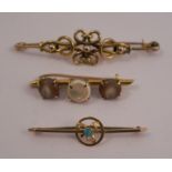 An opal bar brooch, stamped '9ct', together with a bar brooch, tagged '15ct', and an unmarked knot