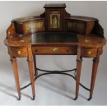 A lady's late 19th century kidney shaped writing desk, in the Carlton House style, having a