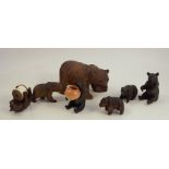 Seven various Black Forest carved models, of bears in various poses, one holding a cotton reel