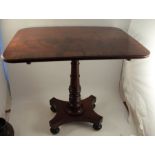 A 19th century mahogany occasional table, having a cross banded top, raised on a turned column