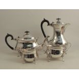 A silver four piece tea set, with gadrooned edge, raised on scroll legs with shell tops, Sheffield