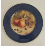 A Royal Worcester plate, decorated with a central panel of fruit by H Everett, to a Sabrina blue