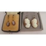 A pair of late Victorian shell cameo earrings, carved with classical female profiles,