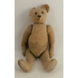 A gold plush teddy bear, with button eyes and stitched nose, height 19ins