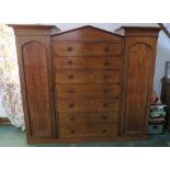 A 19th century mahogany sentry box wardrobe, fitted with five long drawers over one deep long