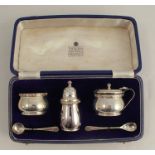A Garrard & Co cased silver condiment set, comprising open salt, covered mustard, pepper and two