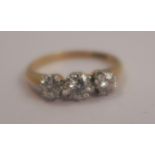 A three stone diamond ring, the transitional brilliant cuts totalling approximately 0.8 carats