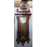 A mahogany cased Vienna style regulator wall clock, with eagle pediment, height 60ins