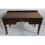 A 19th century mahogany knee hole writing table, in the Gillows style, fitted with one long frieze