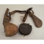 An Antique camel scrotum powder flash, decorated with animals and script, with leather straps,