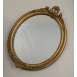 A 19th century gilt framed oval wall mirror, with flower and leaf decoration, overall height 16ins