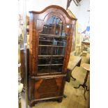 A WALNUT CORNER CABINET, HEIGHT 66INS X MAX DEPTH 40INS