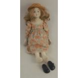 A Prickwillow Pottery porcelain shoulder head doll, with blonde curly hair and painted features,