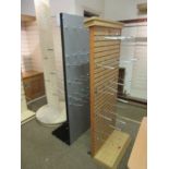 Two Halls sock display stands together with a triangular display stand with perspex shelves