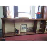 A mahogany free standing three bay display unit, with slatted back, width 115ins x depth 19ins x