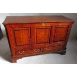 An Antique oak mule chest, with rising lid over a three panelled front and two drawers, width 53.