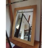 A rectangular wooden framed wall mirror, 42ins x 30ins