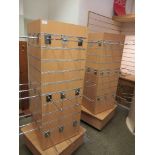 Two square swivel slatted display stands