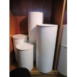 Five various cylindrical white display stands, maximum height 36ins