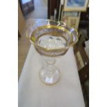 A GLASS CANDLE HOLDER WITH GILT DECORATION, HEIGHT 13INS