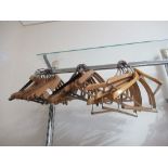 Approximately thirty various coat hangers