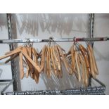 Approximately thirty various coat hangers