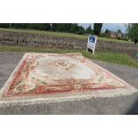 A LARGE MODERN CREAM GROUND CHINESE WOOL WASH RUG , 188INS X 149INS