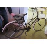 A vintage push bicycle, possibly ARP, for decorative purposes only