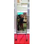 A chrome cheval mirror, approximately 60ins high, together with a pine cheval mirror,