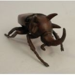 A modern Japanese style bronze model, of a stag beetle, with hinged back, signed, length 4.5ins