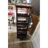 A REVOLVING BOOK STAND, 15INS X 12INS X HEIGHT 39INS