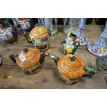 THREE BESWICK NOVELTY COTTAGE TEAPOTS, MAX HEIGHT 7INS AND DOWN, TOGETHER WITH A BURLEIGH WARE