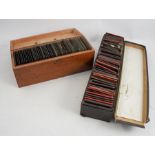 Two boxes of various lantern and glass slides, the one box containing pictorial views, the other