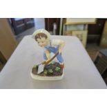 A ROYAL WORCESTER MODEL, SATURDAY'S CHILD, HEIGHT 7INS