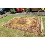 AN EASTERN DESIGN MUSTARD GROUND RUG, 79INS X 116INS