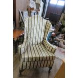 A GEORGIAN DESIGN WING BACK ARMCHAIR