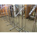 A quantity of chrome free standing display rails