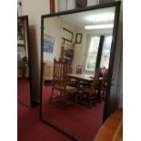 A rectangular plate glass wall mirror, 72ins x 48ins