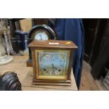 AN OAK MANTLE CLOCK, HAVING WALNUT CASE, WITH SILVER DIAL, STAMPED GARRARD AND CO LIMITED, 112