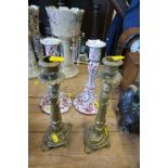 A PAIR OF DELFT CANDLE STICKS, HEIGHT 10.5INS,  TOGETHER WITH A PAIR OF BRASS CANDLE STICKS,