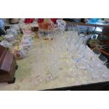 A SUITE OF ASSORTED GLASS, INCLUDING SHERRY GLASSES, WINE GLASSES, TUMBLERS AND TWO DECANTERS