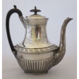 36290 A late Victorian silver coffee pot, with gadrooned and engraved decoration, engraved with a