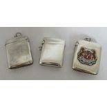 Three hallmarked silver vesta cases, one plain, one with an applied enamel crest for Aberdeen and