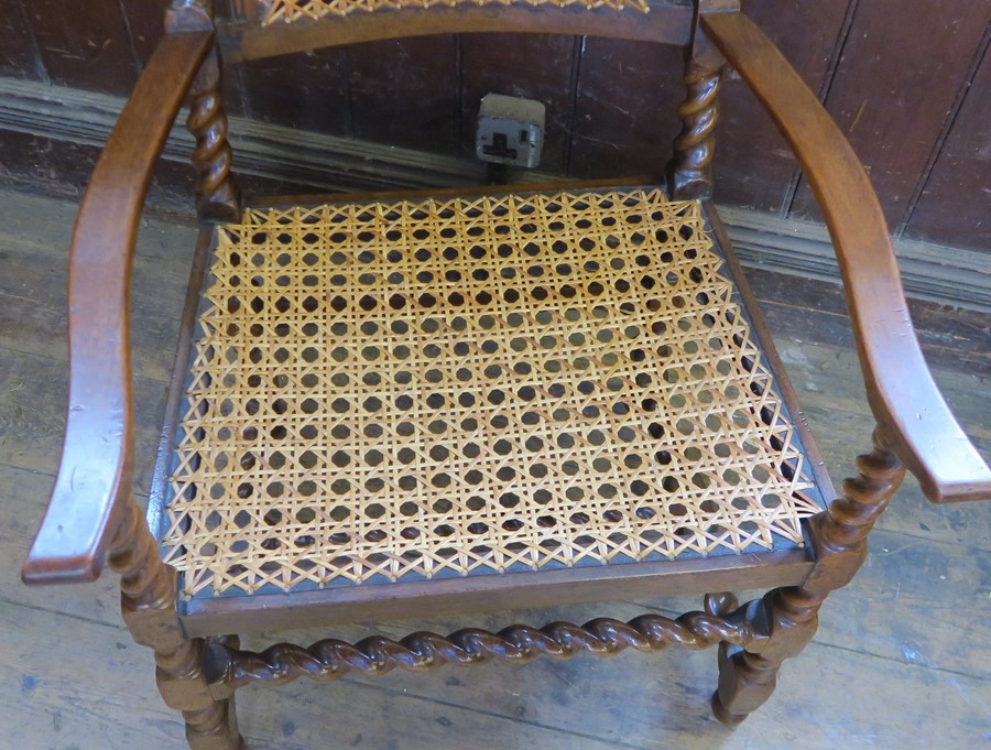 An antique Carolean style walnut bergere open armchair, with all over barley twist turnings and - Image 2 of 3