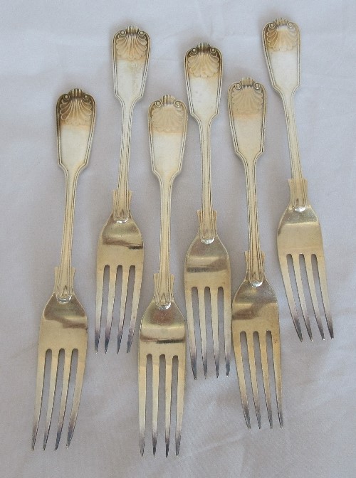 A set of six silver dinner forks, in the fiddle, thread and shell pattern, Sheffield 1942, maker R F