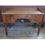 A 19th century mahogany tray top wash stand, fitted with a central drawer, flanked by two short