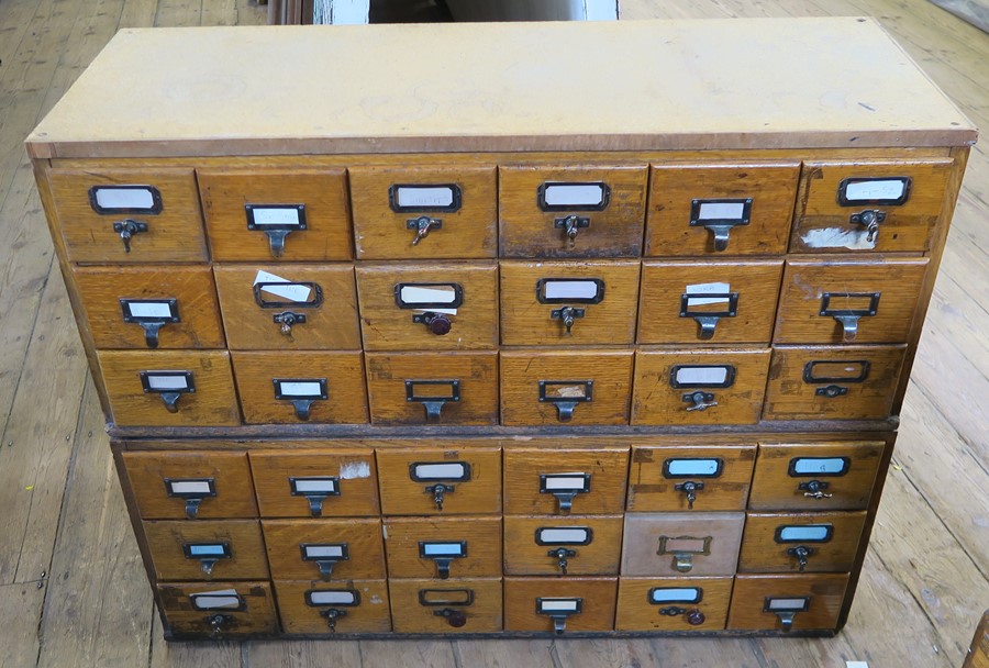 A set of 36 pigeonhole card index drawers, in two sections each of 18 drawers, width 39.75ins  x max