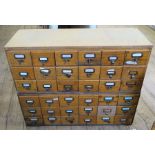 A set of 36 pigeonhole card index drawers, in two sections each of 18 drawers, width 39.75ins  x max