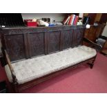 An 18th century oak settle, having five lozenge carved panels to the back, width 72ins x depth 22ins